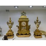 A large French gilt clock garniture having Porcelain panels with mounted Cherub figures, early 20th