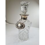 A high quality pretty cut glass decanter having silver neck by Robert and Dere Ltd, London 1989 with