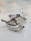 A pair of novelty glass salts in the form of ducks, having silver pierced wings, one duck's wings ar