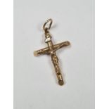 Unmarked yellow metal crucifix pendant, inscribed INRI, 3cm x 2cm, 1.98g approx