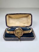 Antique 9ct gold cased watch on adjustable strap, in blue leather fitted case