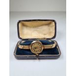 Antique 9ct gold cased watch on adjustable strap, in blue leather fitted case