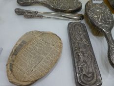 A selection of 1920s high grade Chinese silver, tested. Comprising of a silver shoe horn and lace pu