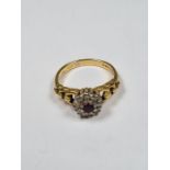 18ct yellow gold ruby and diamond cluster ring with graduating looped shoulders, size O, 4.75g, mark