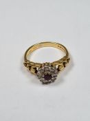 18ct yellow gold ruby and diamond cluster ring with graduating looped shoulders, size O, 4.75g, mark