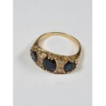 18ct yellow gold dress ring with 3 oval cut sapphires, each separated with three round cut diamonds,