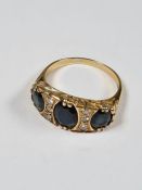 18ct yellow gold dress ring with 3 oval cut sapphires, each separated with three round cut diamonds,