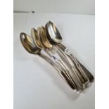 A set of eight silver Georgian dessert spoons by Robert Ruttland, London 1809 - 1811 19.58ozt approx