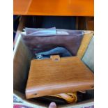 A box of leather items to include leather handbags, diary and satchels