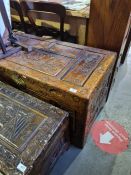 A 20th Century Chinese carved camphorwood blanket box decorated birds and foliage, 101.5cms