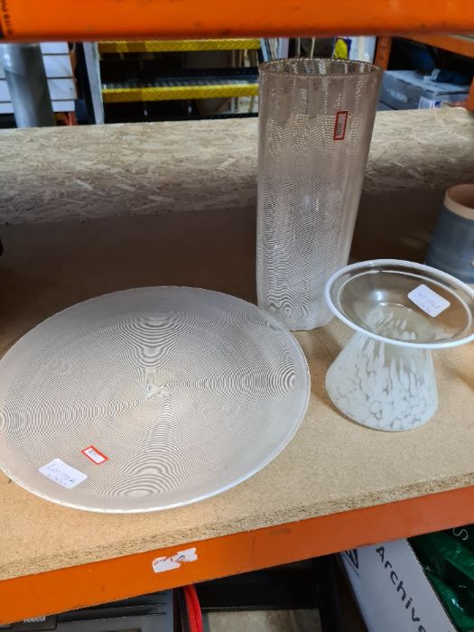 Three white and clear glass items including a circular dish and two vases
