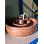 An old oak bucket with copper banding and a wooden bowl with ships wheel nutcracker