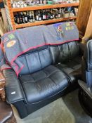 A matching black leather 'Stressless Ekornes' two seat settee
