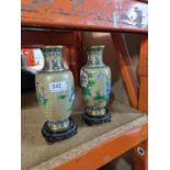 A pair of modern Cloisonné  enamelled vases on wooden stands