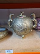 A Chinese brass globular censer decorated figures with dragon handles and a similar circular bowl