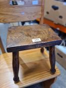 An old milking stool having Elm top and a reproduction oak cupboard having one drawer