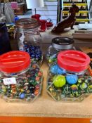 Four tubs of marbles