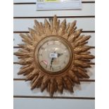 A vintage Smith's Sunburst wall clock