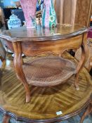 Drexel Heritage, a small oval shaped two tier coffee table