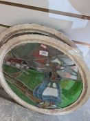 Two old circular leaded glass windows decorated Dutch style figures, 50cms