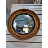 Round convex mirror in gold and black frame