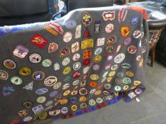 A vintage Scouting blanket, 1960s onwards for the Boy Scouts of America containing over 100 badges a