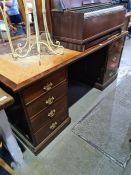 A mid-Century mahogany Partner's desk having seven drawers with cupboards to reverse, 182.5cms