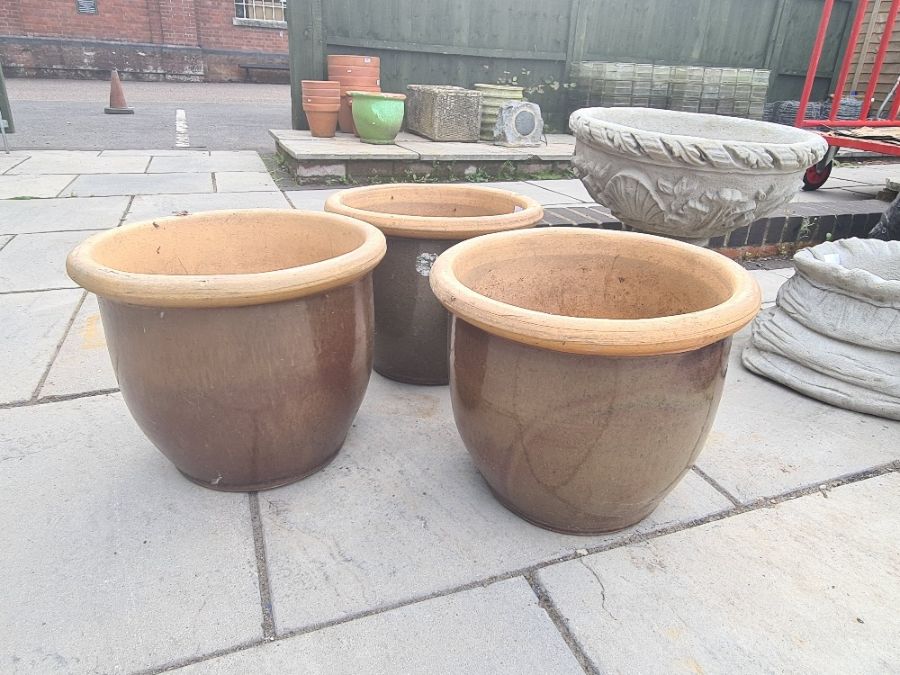 Three matching garden pots