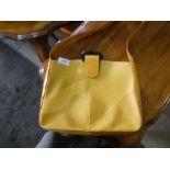 A modern Louis Vuitton satchel style handbag of mustard colour and one other Bally black handbag