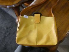 A modern Louis Vuitton satchel style handbag of mustard colour and one other Bally black handbag