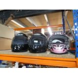 Three various motorcycle helmets, a motorcycle jacket and a black leather jacket