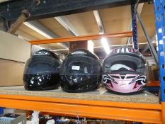 Three various motorcycle helmets, a motorcycle jacket and a black leather jacket