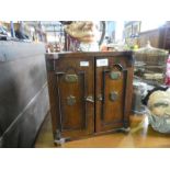 An early 20th Century oak tobacco box having 3 internal drawers, 2 Doulton character jugs and a pewt