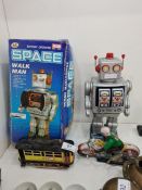 A vintage tin plate battery operated Space Walkman (boxed) and two other items