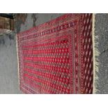 A large modern Bakar carpet having repeated rows of elephant pad design, 369cm x 277cm