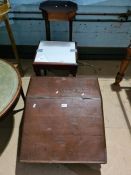 An old table top clerk's desk having sloping lid and two other items