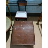 An old table top clerk's desk having sloping lid and two other items