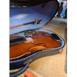 Violin with bow in case. Interior label 'Copy of Antonius Stradivarius'