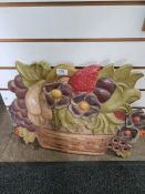 Carved wooden plaque of flowers and fruit