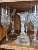 Mixed drinking glasses and two pairs of candlesticks