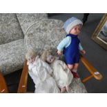 A Victorian German bisque head doll and two others