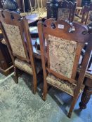 A set of six late Victorian walnut dining chairs with floral carved top rail
