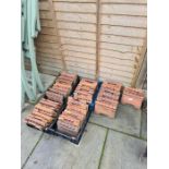 Over 50 terracotta edging tiles having ropetwist design