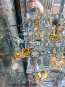 A quantity of decorative miniature clocks