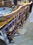 A set of four Ercol stickback dining chairs