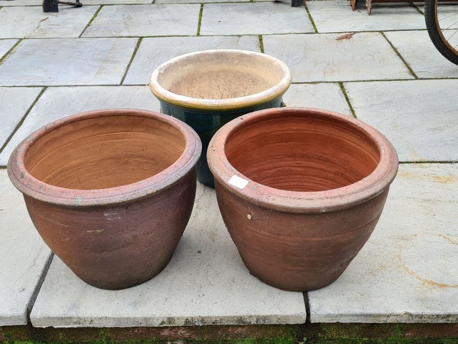 A pair of garden pots and one other