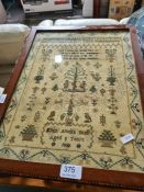 A mahogany tripod table with oblong top inset antique sampler, 1800, decorated figures, animals and