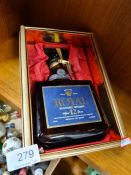 A bottle of Royal Suntory Whisky, Product of Japan, 720ml, 86 proof, and a box of miniatures