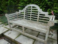A teak bench of Lutyens style