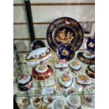 A shelf of decorative limoges trinket boxes and similar and one other shelf of China and crystal